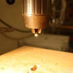 Screw mounted in drill press chuck
